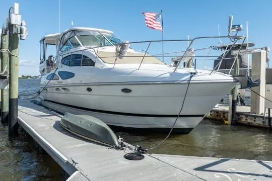 Lunasea Yacht Photos Pics 2005 Cruiser Yachts 405 EXPRESS docked, featuring sleek design and American flag.