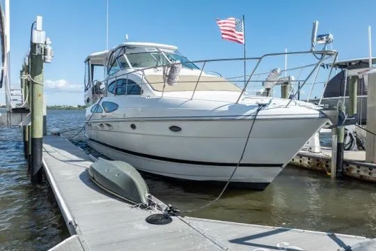 Lunasea Yacht Photos Pics 2005 Cruiser Yachts 405 EXPRESS docked, featuring sleek design and American flag.
