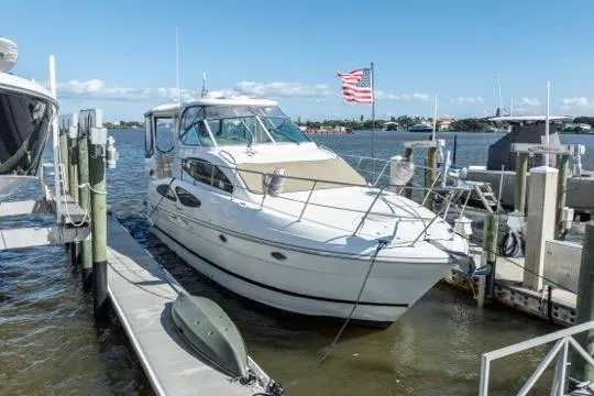 Lunasea Yacht Photos Pics 2005 Cruiser Yachts 405 EXPRESS docked at marina with American flag.