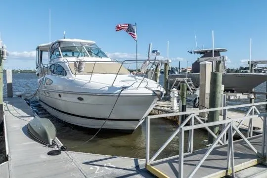 Lunasea Yacht Photos Pics 2005 Cruiser Yachts 405 EXPRESS docked at marina with American flag.