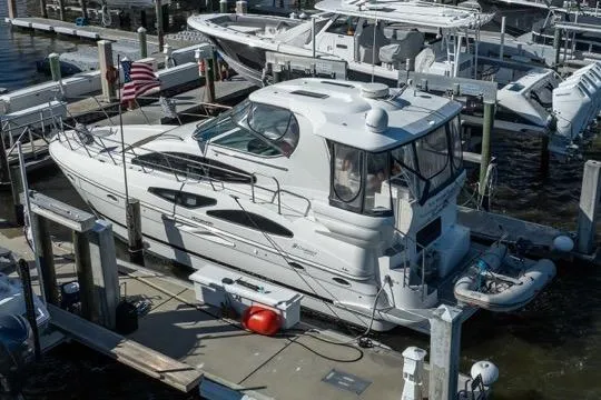 Lunasea Yacht Photos Pics 2005 Cruiser Yachts 405 EXPRESS docked at marina, featuring sleek design and American flag.