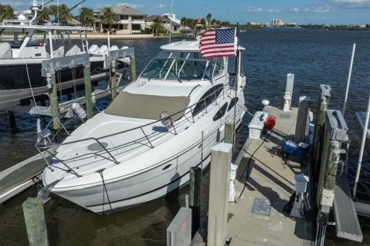 Lunasea Yacht Photos Pics 2005 Cruiser Yachts 405 EXPRESS docked at marina with American flag.