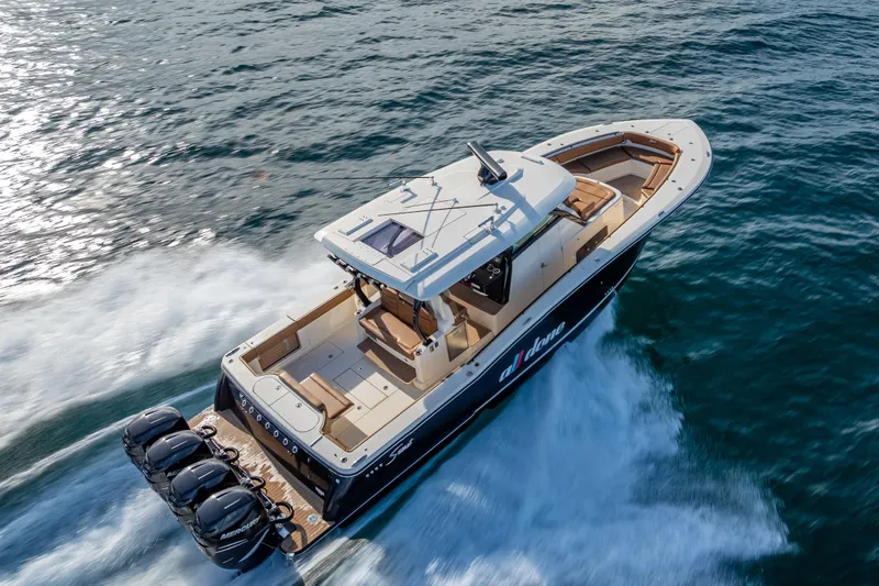  Yacht Photos Pics 2021 Scout 380 LXF boat cruising on open water, showcasing luxury design and powerful engines.