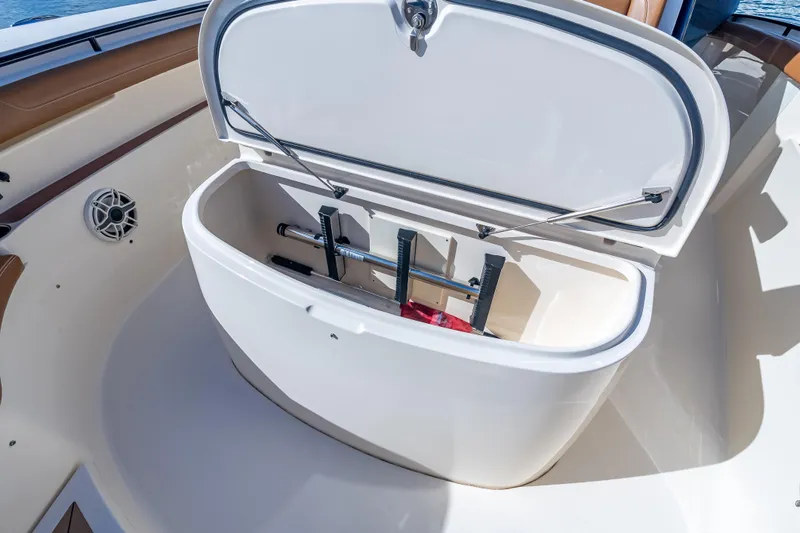  Yacht Photos Pics Open storage compartment on 2021 Scout 380 LXF boat, showcasing interior features.