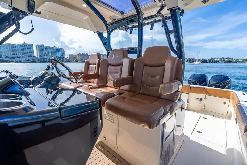  Yacht Photos Pics 2021 Scout 380 LXF boat interior with luxurious seating and modern dashboard.