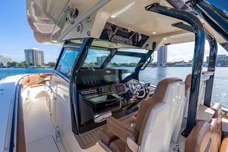  Yacht Photos Pics 2021 Scout 380 LXF boat interior with luxurious seating and advanced navigation system.