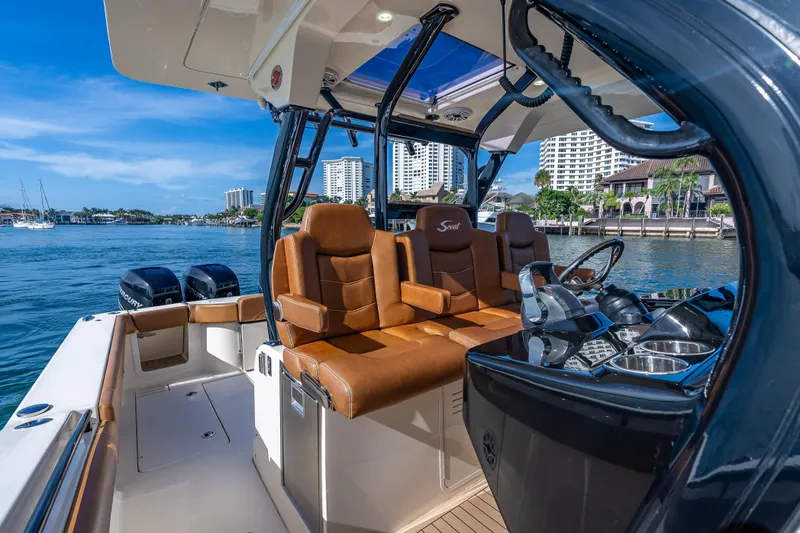  Yacht Photos Pics 2021 Scout 380 LXF boat interior with luxurious seating and modern dashboard.