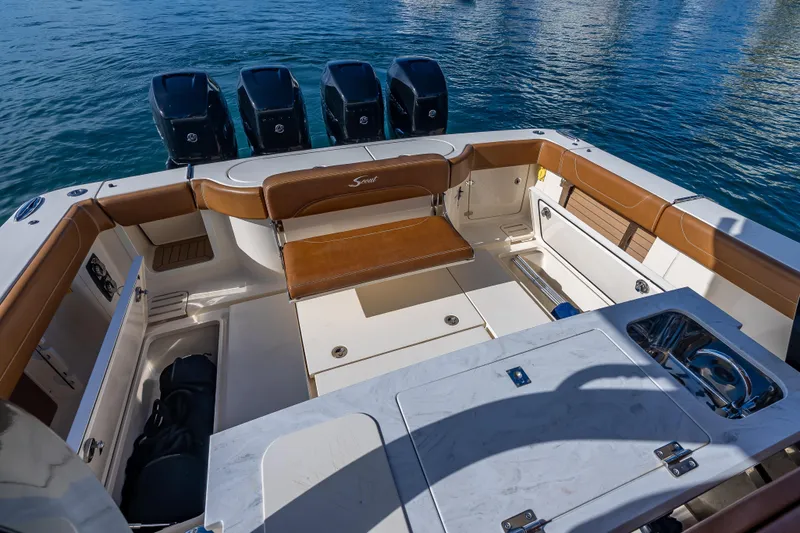  Yacht Photos Pics 2021 Scout 380 LXF boat interior with luxurious seating and multiple outboard engines.