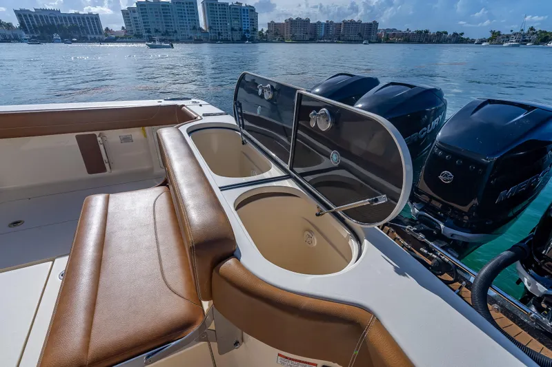  Yacht Photos Pics 2021 Scout 380 LXF boat interior with seating and dual outboard engines.