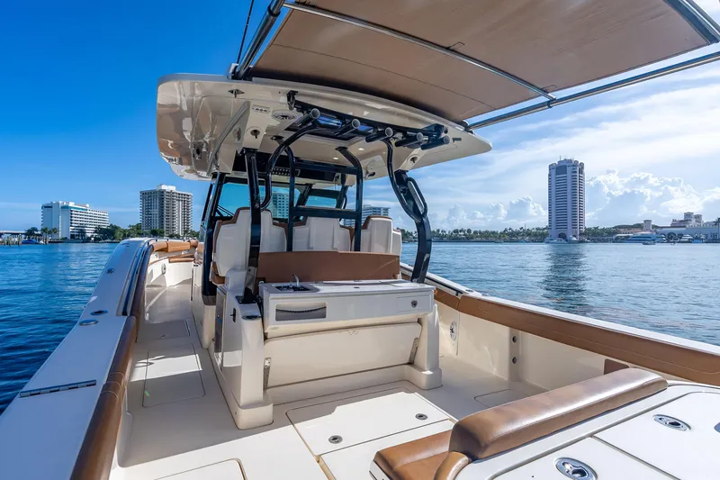  Yacht Photos Pics 2021 Scout 380 LXF boat interior with city skyline and waterfront view.