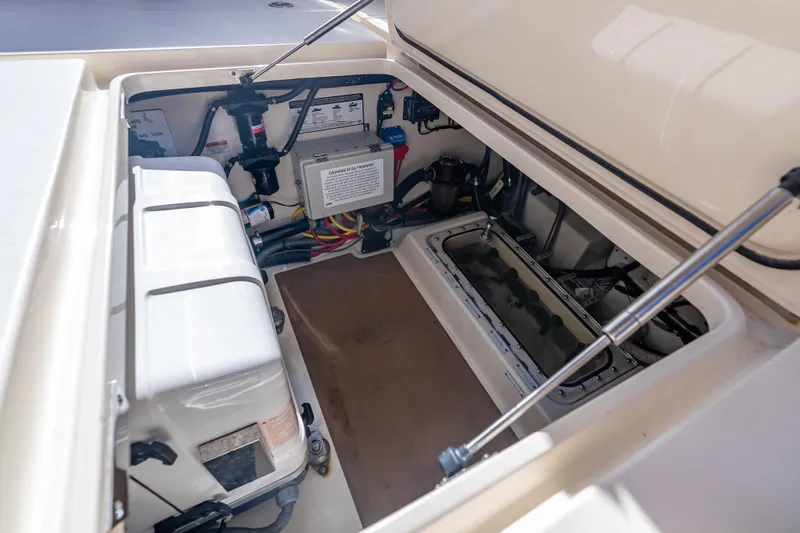  Yacht Photos Pics 2021 Scout 380 LXF boat storage compartment with electrical components and wiring.
