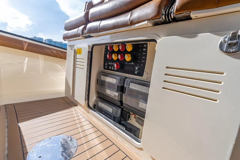  Yacht Photos Pics 2021 Scout 380 LXF boat electrical panel with storage compartments.