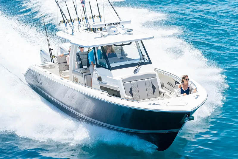  Yacht Photos Pics Manufacturer Provided Image: 2025 Pursuit S 358 Sport boat cruising on clear blue water.
