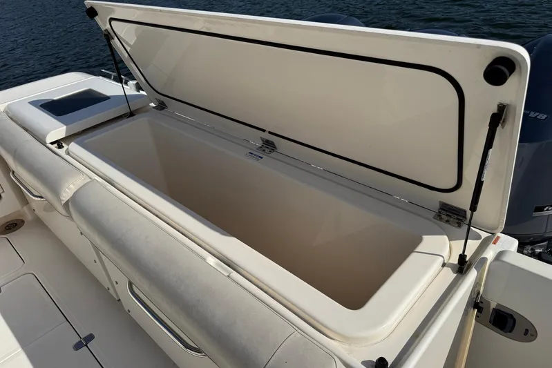 Pescador Yacht Photos Pics Open storage compartment on 2011 Pursuit OS 375 Offshore boat, near water.