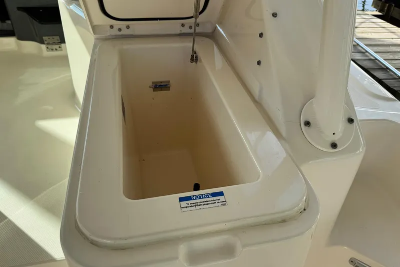 Pescador Yacht Photos Pics 2011 Pursuit OS 375 Offshore boat storage compartment, open and empty.