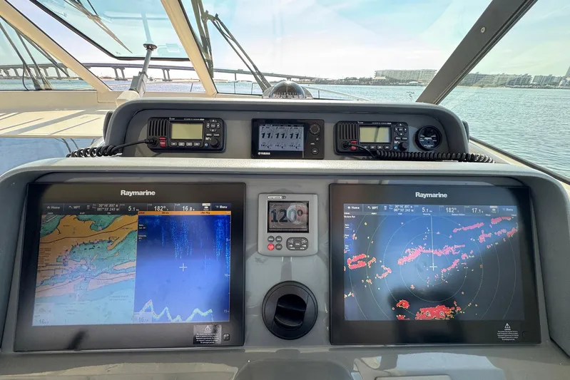Pescador Yacht Photos Pics 2011 Pursuit OS 375 Offshore boat dashboard with Raymarine navigation displays.