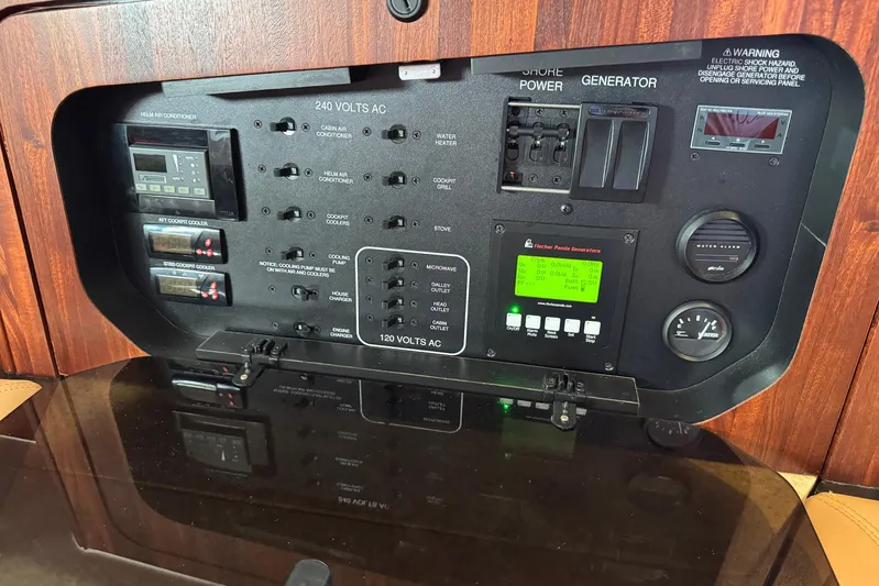 Pescador Yacht Photos Pics Electrical control panel of a 2011 Pursuit OS 375 Offshore boat.