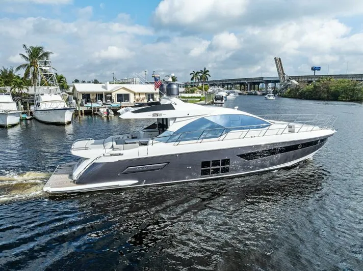 Blessed Yacht Photos Pics 2020 Azimut S6 yacht cruising on a sunny day near a marina.