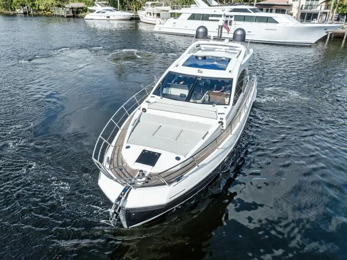 Blessed Yacht Photos Pics Azimut S6 2020 luxury yacht cruising in a marina with other boats.