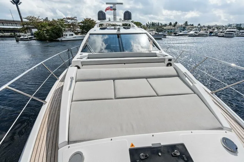 Blessed Yacht Photos Pics 2020 Azimut S6 yacht with spacious deck, docked in a marina.