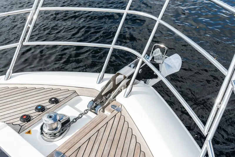 Blessed Yacht Photos Pics Azimut S6 2020 yacht bow with anchor and teak decking on water.