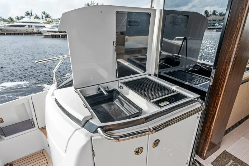Blessed Yacht Photos Pics Outdoor kitchen on 2020 Azimut S6 yacht with sink and grill by the water.