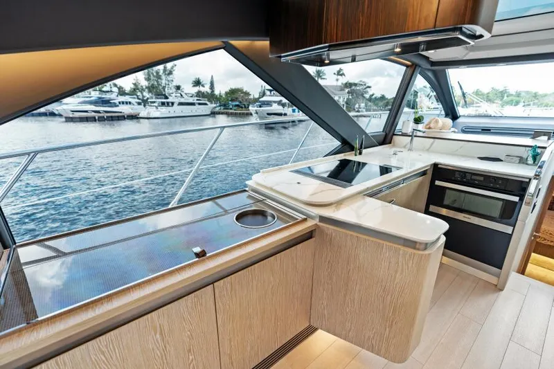 Blessed Yacht Photos Pics Luxurious interior of 2020 Azimut S6 yacht with modern kitchen and scenic water view.