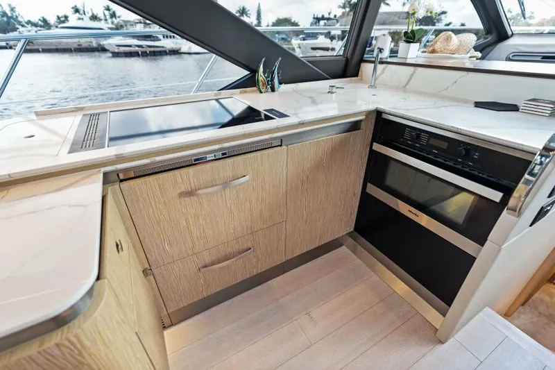 Blessed Yacht Photos Pics Modern kitchen interior on 2020 Azimut S6 yacht with sleek appliances and waterfront view.