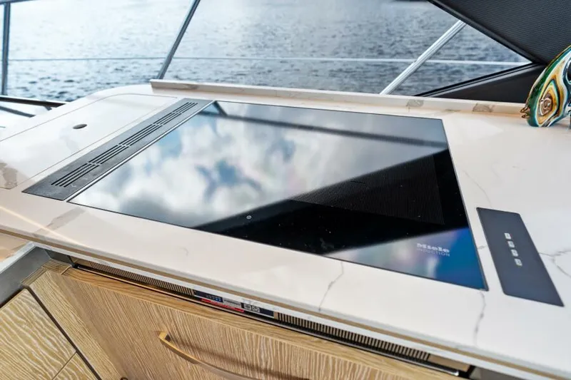 Blessed Yacht Photos Pics Modern kitchen countertop on 2020 Azimut S6 yacht, featuring sleek design and ocean view.