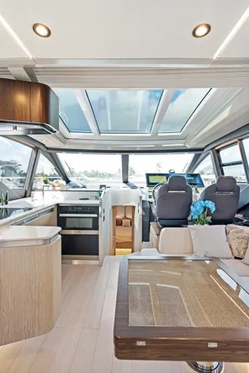 Blessed Yacht Photos Pics Luxurious interior of 2020 Azimut S6 yacht with modern design and panoramic windows.