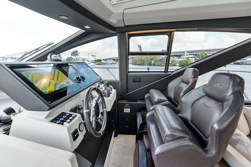 Blessed Yacht Photos Pics Interior of 2020 Azimut S6 yacht with modern dashboard and leather seats.