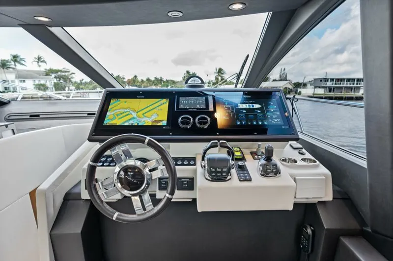 Blessed Yacht Photos Pics Cockpit of 2020 Azimut S6 yacht with advanced navigation system and steering wheel.