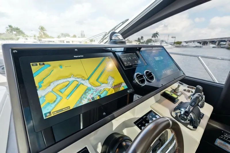 Blessed Yacht Photos Pics Cockpit of 2020 Azimut S6 yacht with navigation screens and controls.