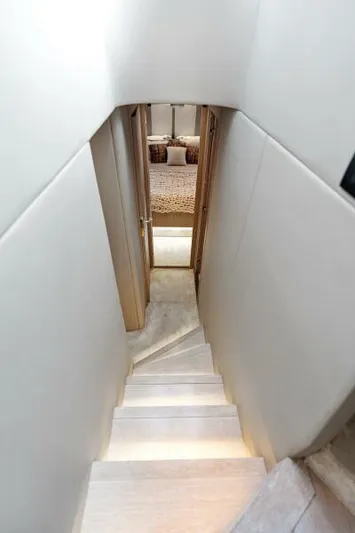 Blessed Yacht Photos Pics Staircase leading to a cozy cabin in a 2020 Azimut S6 yacht.