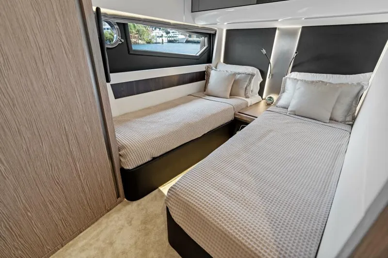 Blessed Yacht Photos Pics Luxurious twin cabin in 2020 Azimut S6 yacht, featuring modern design and elegant bedding.