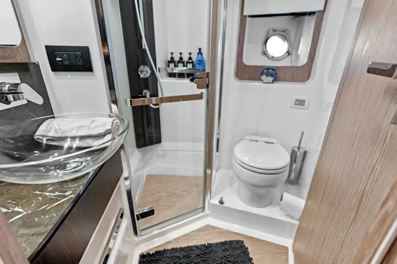 Blessed Yacht Photos Pics Luxurious bathroom in 2020 Azimut S6 yacht with modern fixtures and elegant design.