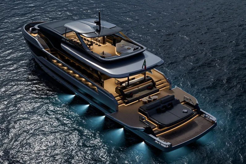 X106 Fast Yacht Photos Pics Luxurious 2026 Extra X 106 FAST yacht illuminated on the ocean at night.