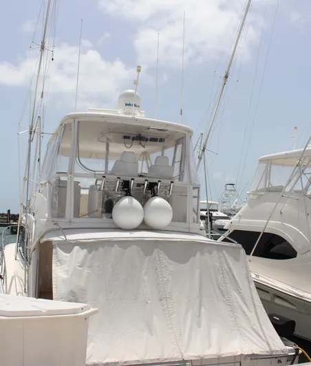  Yacht Photos Pics 2005 Riviera 51 Flybridge yacht docked at marina.