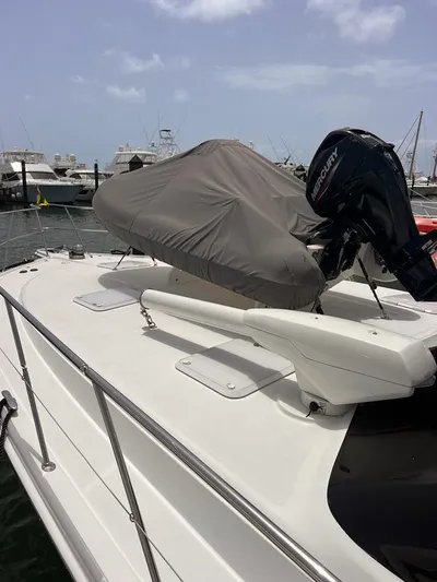  Yacht Photos Pics 2005 Riviera 51 Flybridge yacht with covered equipment on deck.