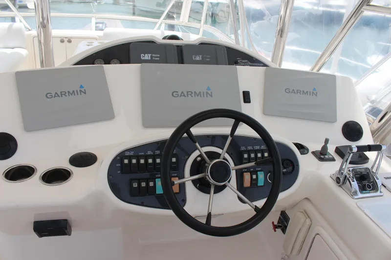  Yacht Photos Pics Helm station of a 2005 Riviera 51 Flybridge with Garmin navigation systems.