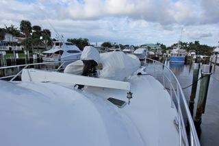2001 Precision Convertible yacht docked at a marina with other boats.