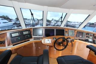 2001 Precision Convertible yacht cockpit with advanced navigation systems and panoramic windows.
