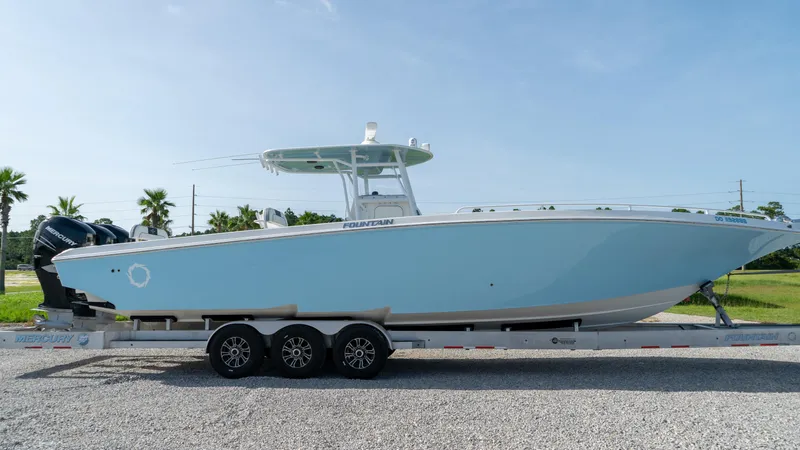  Yacht Photos Pics 2007 Fountain 38TE Cuddy Cabin boat on a trailer, side view.