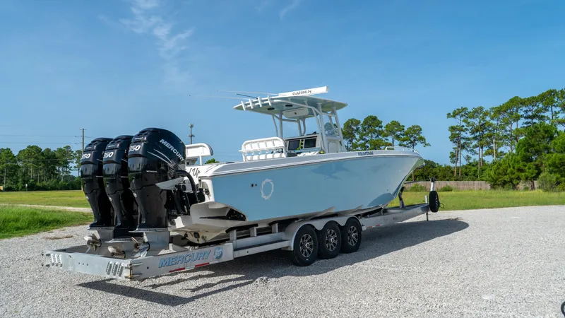  Yacht Photos Pics 2007 Fountain 38TE Cuddy Cabin boat on a trailer with triple Mercury outboard engines.