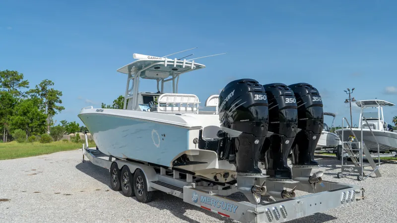  Yacht Photos Pics 2007 Fountain 38TE Cuddy Cabin boat with triple Mercury 350 engines on trailer.