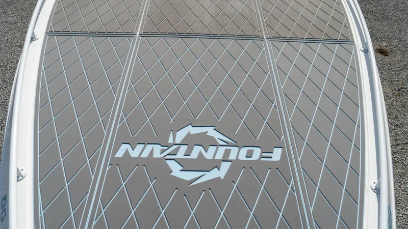  Yacht Photos Pics 2007 Fountain 38TE Cuddy Cabin boat deck with logo and diamond pattern.