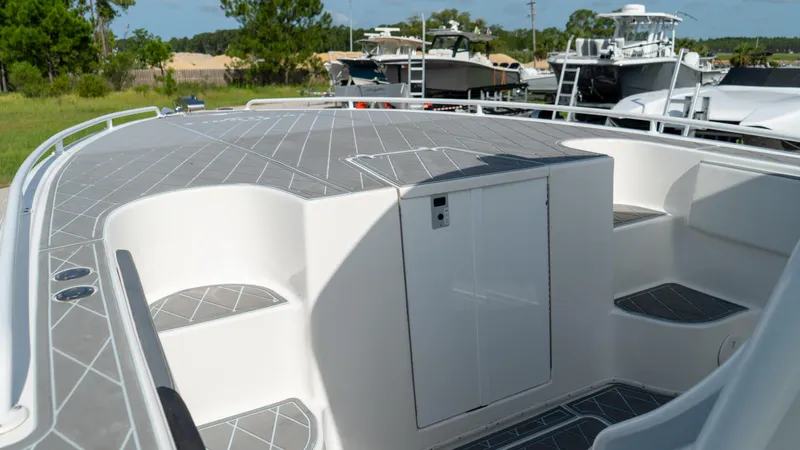  Yacht Photos Pics 2007 Fountain 38TE Cuddy Cabin boat deck with storage compartment.