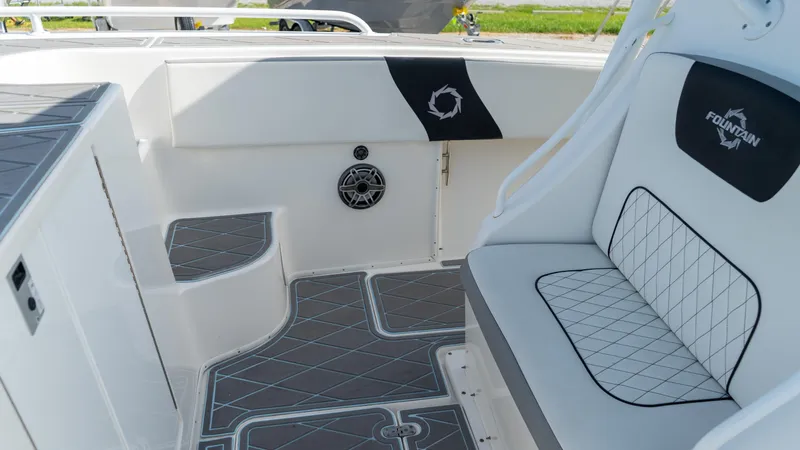  Yacht Photos Pics 2007 Fountain 38TE Cuddy Cabin interior with cushioned seating and stylish flooring.