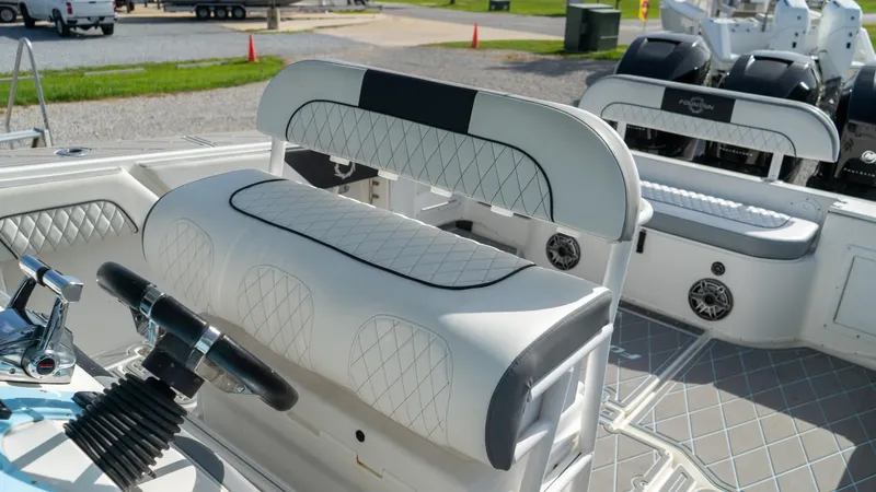  Yacht Photos Pics 2007 Fountain 38TE Cuddy Cabin boat interior with white and black seating.