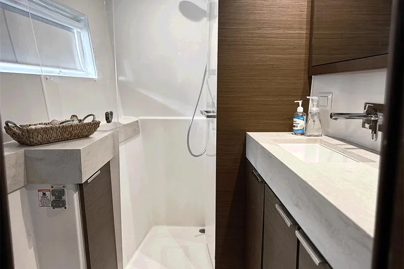 Coquina Yacht Photos Pics Modern bathroom in 2019 Lagoon 40 yacht with shower and sink.